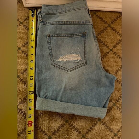 Free People distressed medium wash denim button fly cuffed shorts. 25 - Picture 7 of 12